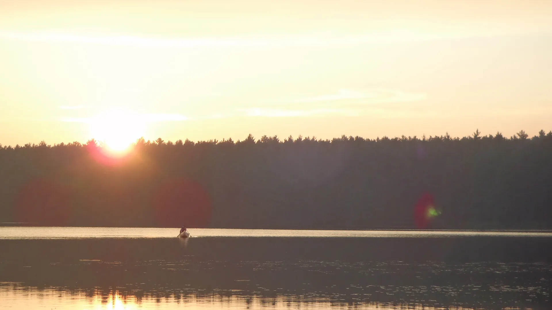 Canoers at sunset in Algonquin Provincial Park